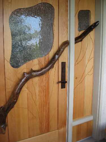 Exterior door with branch and glass, along with side panel